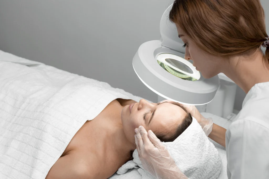 beautician-doing-face-beauty-routine-female-client-beauty-clinic